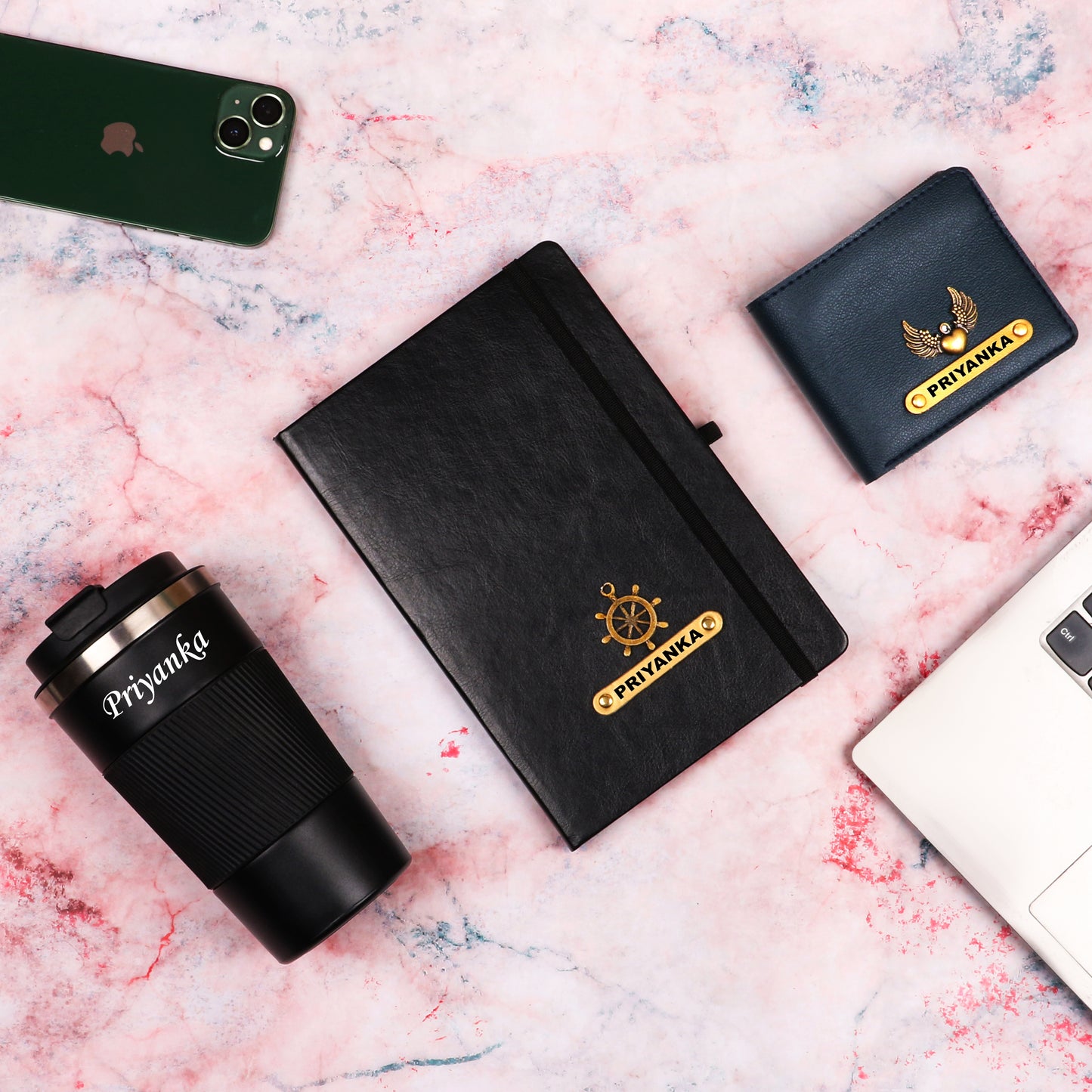 Black diary with tumbler and dark blue wallet