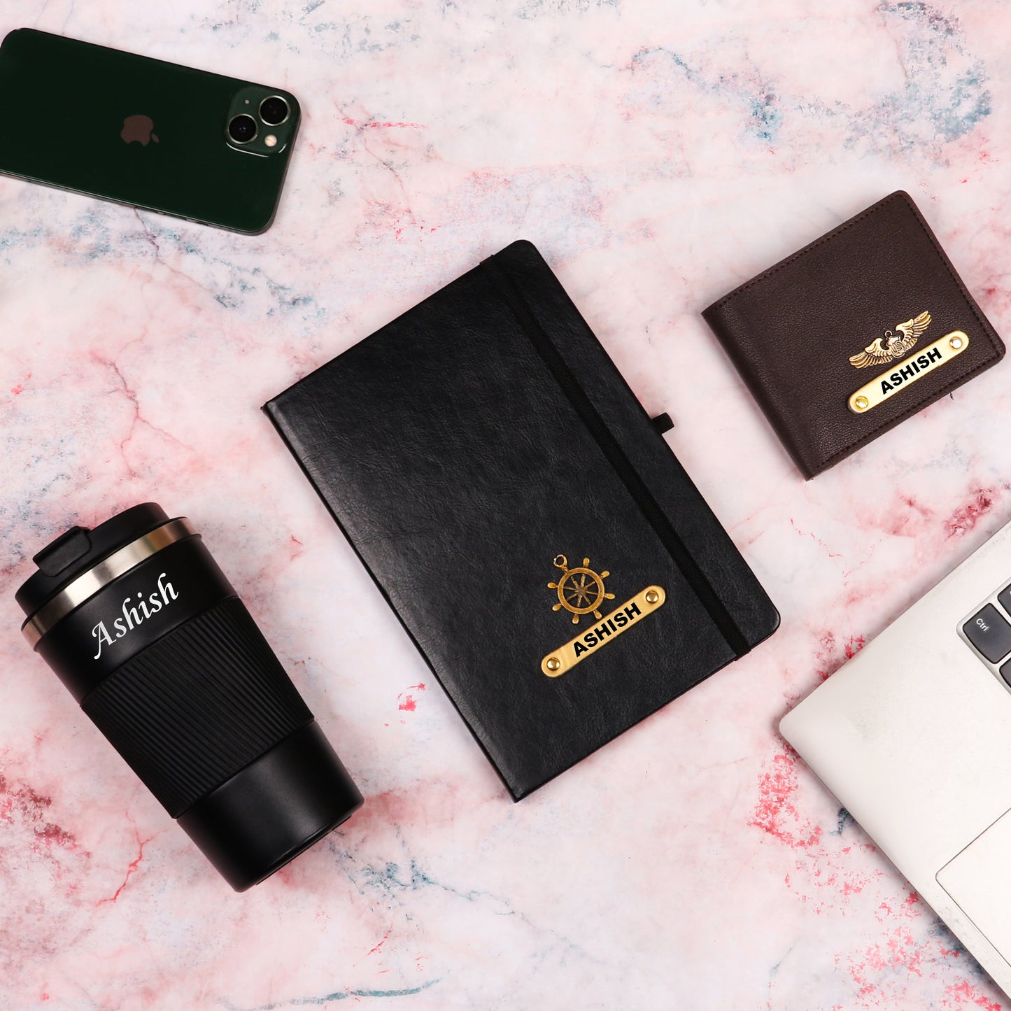 Black diary with tumbler and brown wallet