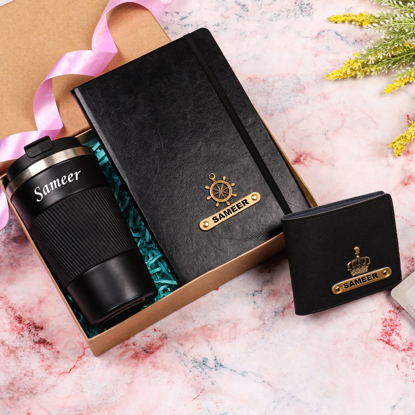Black tumbler with dairy and wallet