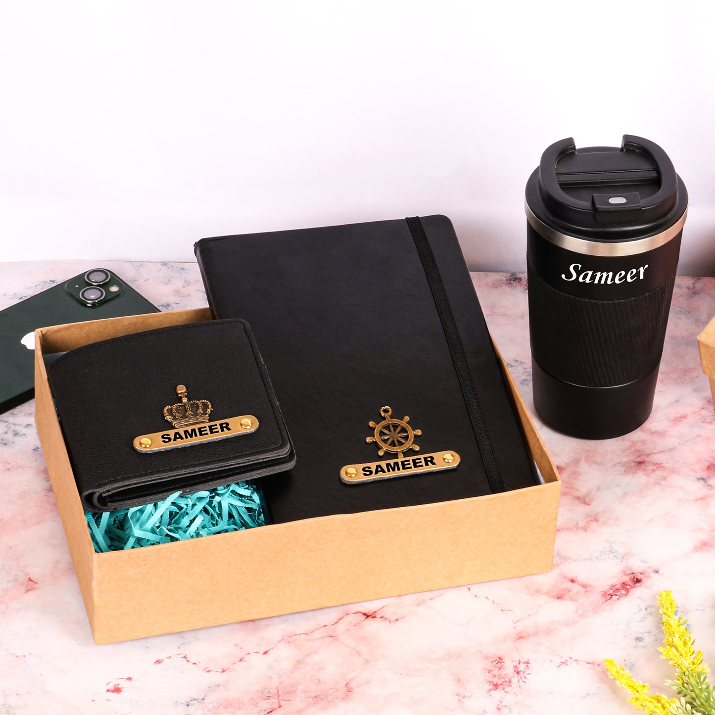 Black tumbler with dairy and wallet