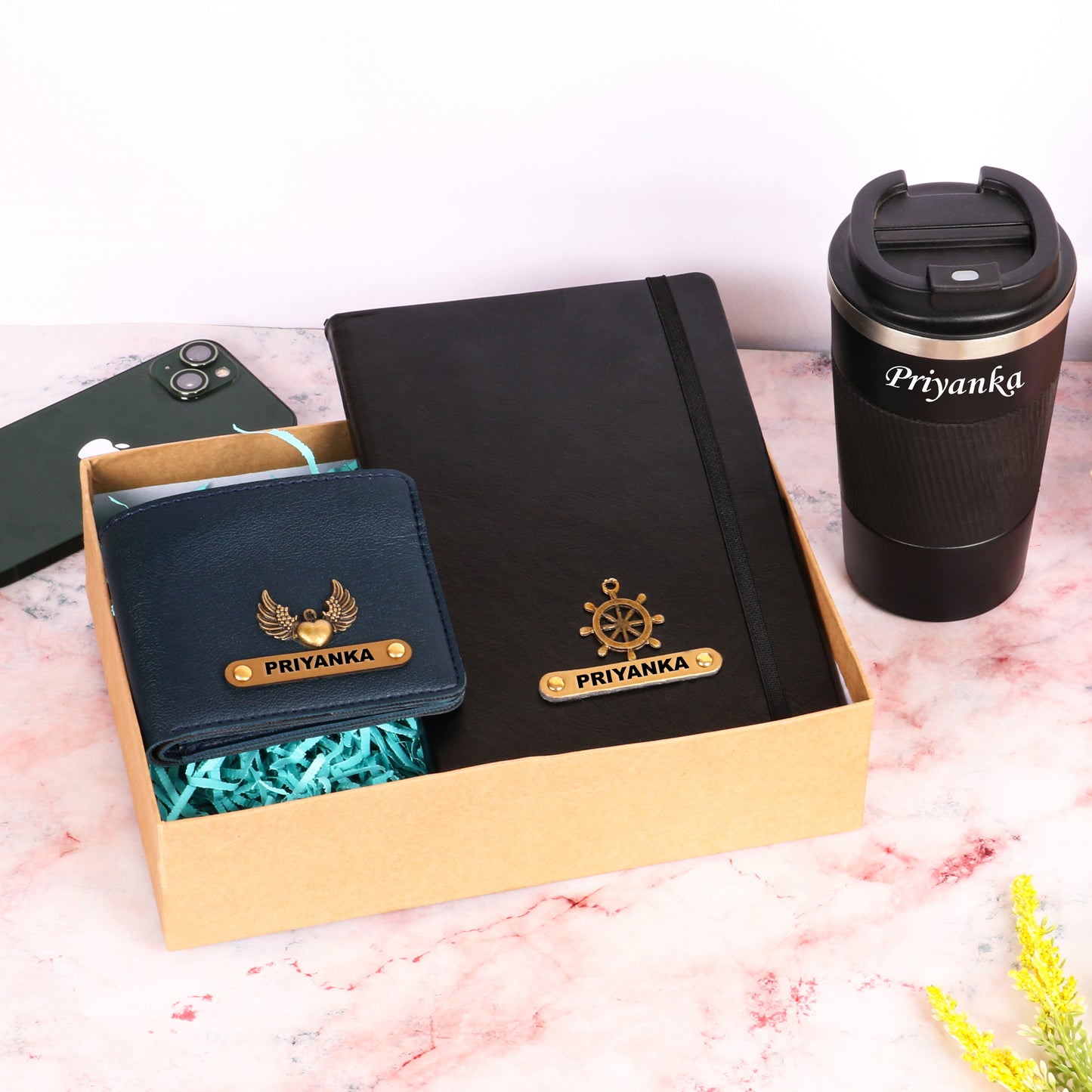 Black diary with tumbler and dark blue wallet