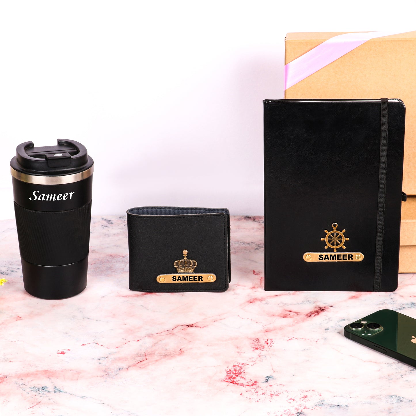 Black tumbler with dairy and wallet