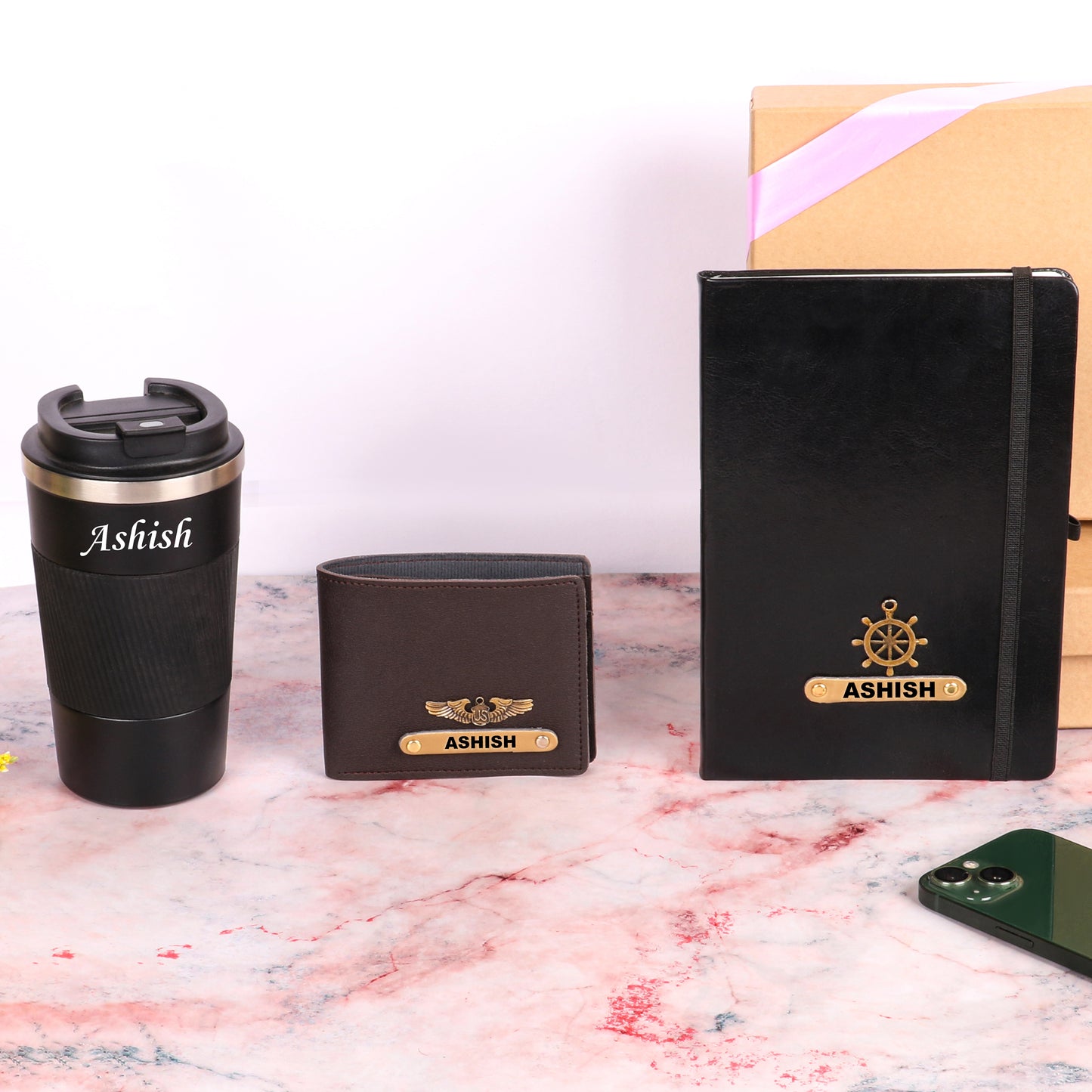 Black diary with tumbler and brown wallet