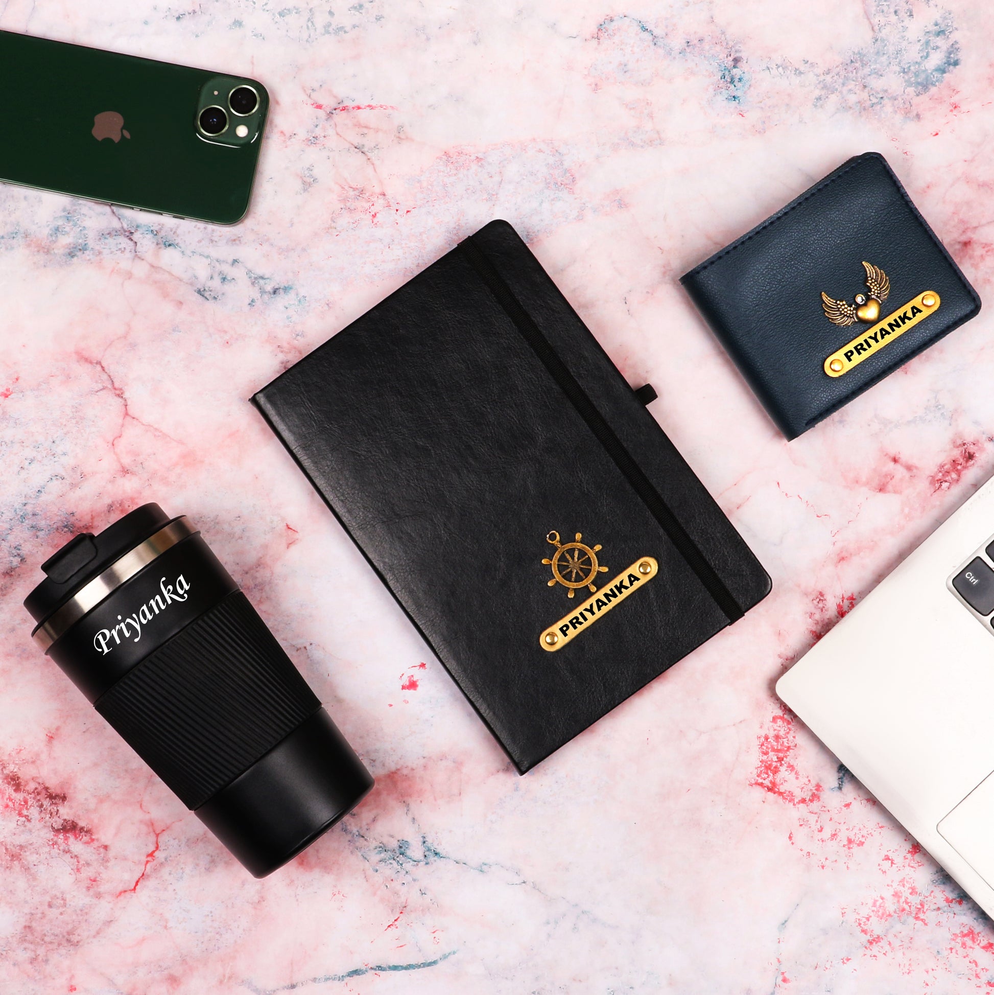 Black diary with tumbler and dark blue wallet