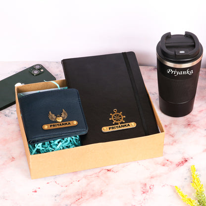 Black diary with tumbler and dark blue wallet